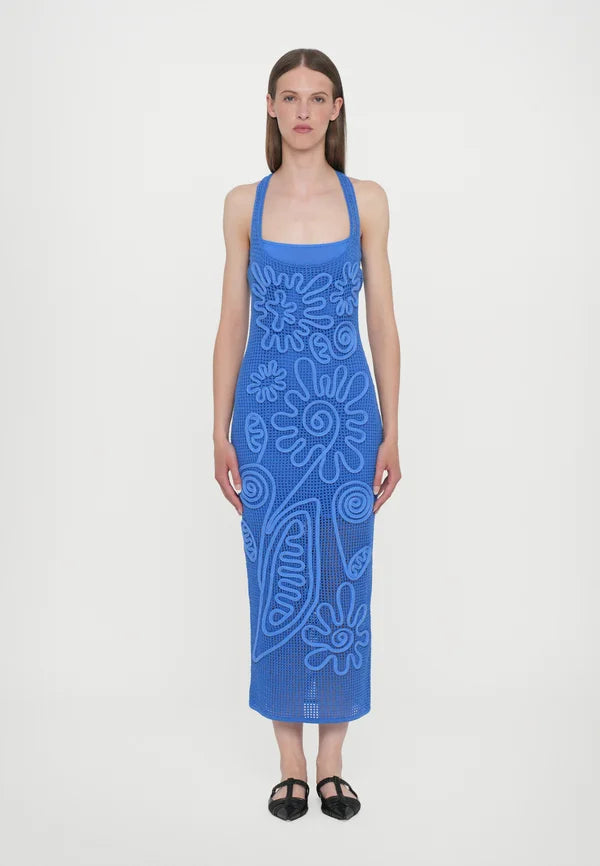 Elevate your wardrobe with the Nissa Dress in Capri by Cult Gaia, featuring a sophisticated sleeveless midi silhouette. Crafted with a delicate netting body, it is beautifully adorned with a detailed floral cord overlay for a refined texture and visual interest. Fully lined with a mini slip, this dress ensures comfortable coverage and ease of wear. Its effortless pull-on design offers convenience without compromising style, making it an ideal choice for elegant day or evening occasions.