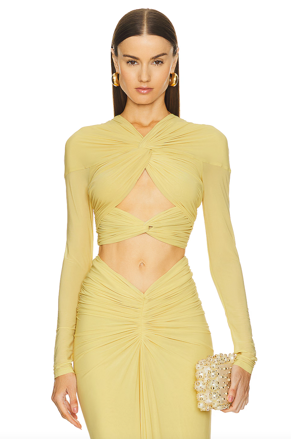 Expertly crafted, the Chase Skirt and Bebe Top by Ronny Kobo features a fully lined design for comfort and structure. Its hidden back zipper ensures a sleek silhouette and easy wear. The ruched slinky jersey fabric offers a sophisticated stretch and subtle texture, enhancing fit and movement. Ideal for occasions where refined style and ease are essential.