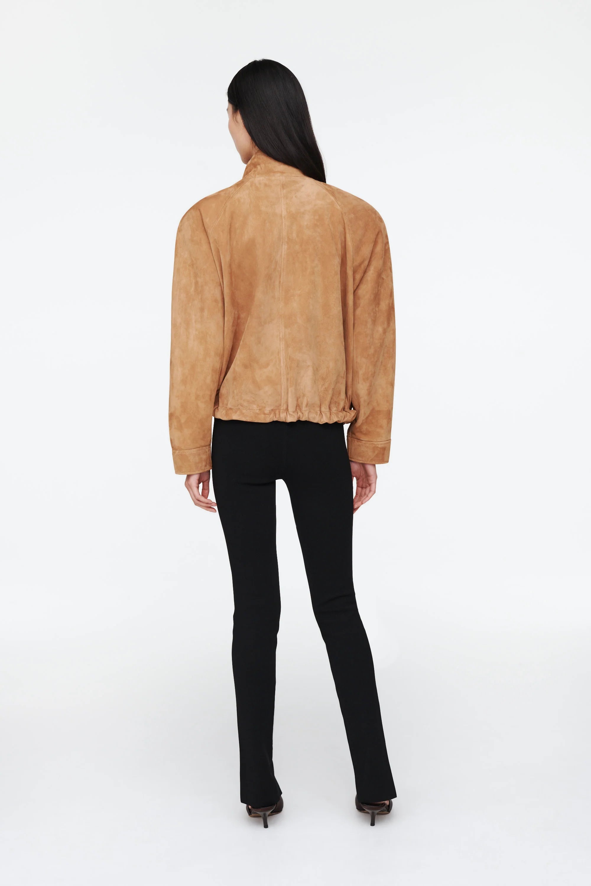 The Anastasia Suede Jacket by Ducie London offers a refined take on the classic aviator style, featuring a short stand collar that enhances its sleek profile. Its adjustable hem with drawstrings allows for a personalized fit, ensuring comfort and versatility. Crafted for enduring appeal, this jacket combines timeless design with functional details, making it a dependable choice for layering across seasons.