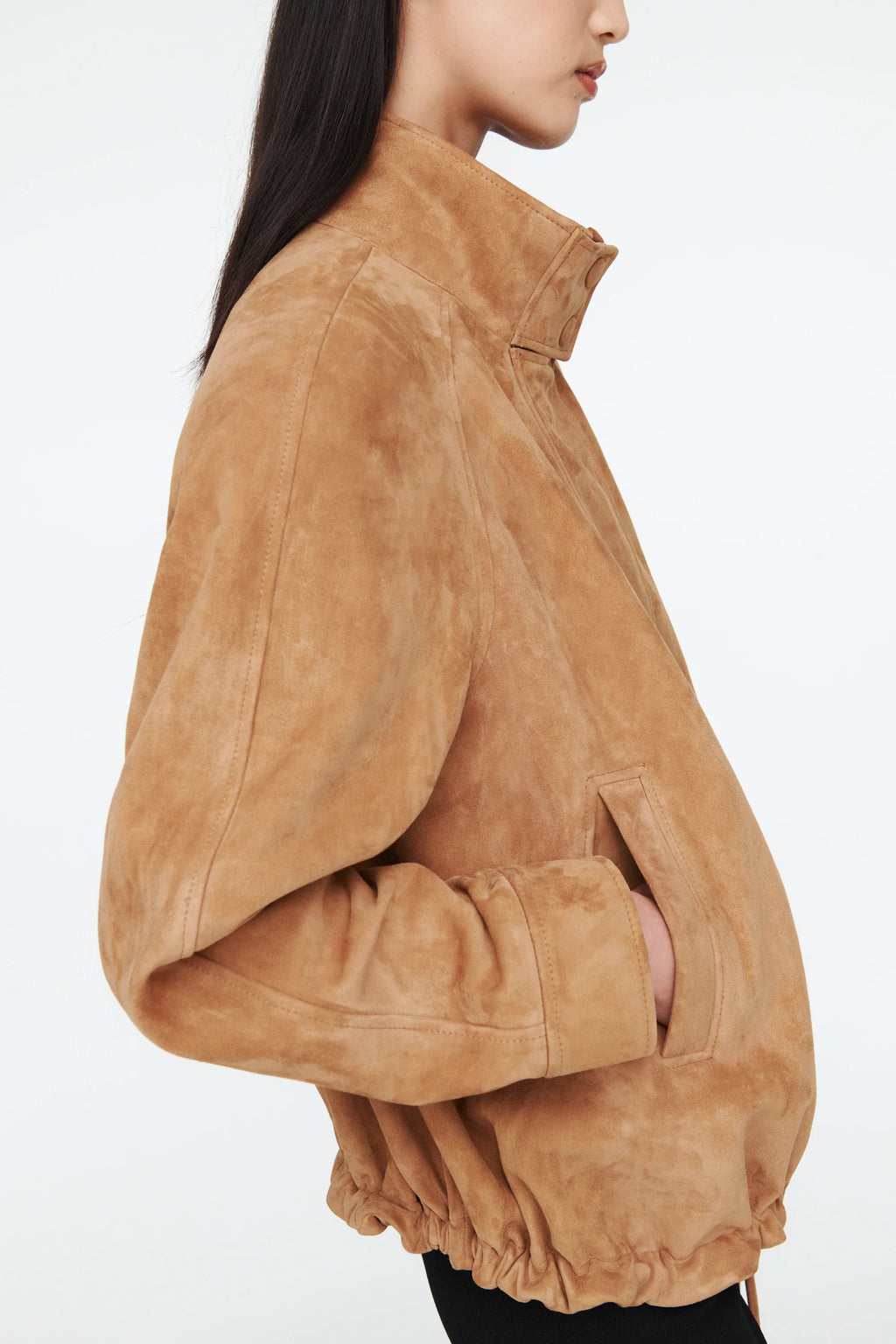 The Anastasia Suede Jacket by Ducie London offers a refined take on the classic aviator style, featuring a short stand collar that enhances its sleek profile. Its adjustable hem with drawstrings allows for a personalized fit, ensuring comfort and versatility. Crafted for enduring appeal, this jacket combines timeless design with functional details, making it a dependable choice for layering across seasons.