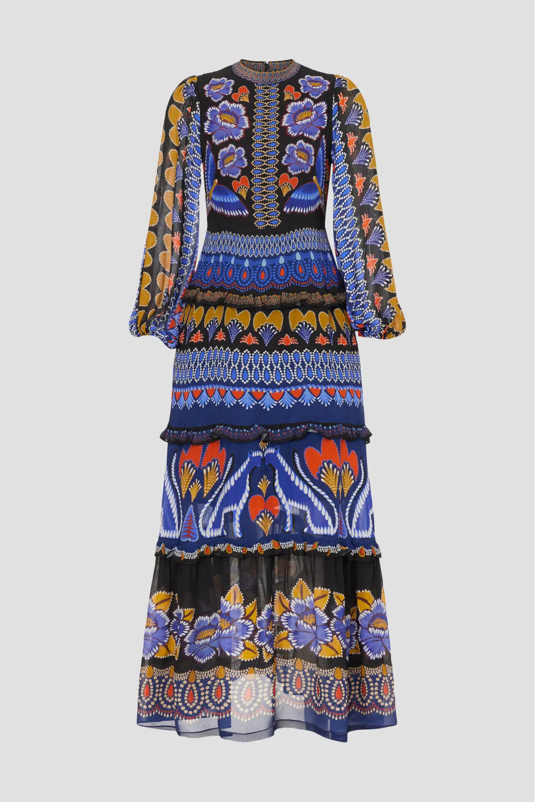 Brighten up fall with the Anika Maxi Dress from FARM Rio, featuring colorful contrasting prints and a charming ruffle trim. Made from lightweight black geometric print chiffon, this A-line dress flows elegantly with long sleeves and a stylish mock neck. The back zipper ensures a perfect fit, while the 56-inch length creates a dramatic silhouette. Perfect for those who want to capture summer's vibrant spirit all season long.