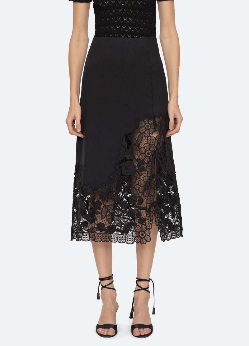 The Katharine Skirt showcases a sophisticated asymmetrical front slit complemented by delicate self ties, enhancing its elegant silhouette. Crafted with intricate floral lace and detailed embroidery, this skirt offers a refined texture and visual appeal. Designed to coordinate seamlessly with the Katharine embroidered slip top, it provides a polished, cohesive look ideal for elevated occasions.