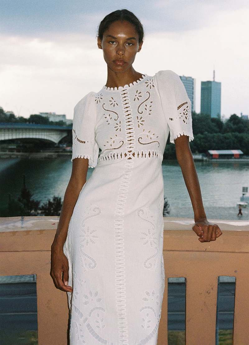 The Liat Dress by Sea New York combines delicate eyelet floral embroidery with thoughtful cutout accents and refined scalloped trim, offering a sophisticated touch to your wardrobe. Its short sleeves and intricate detailing create an elegant yet breathable design, perfect for warm weather occasions where effortless style and comfort are essential.