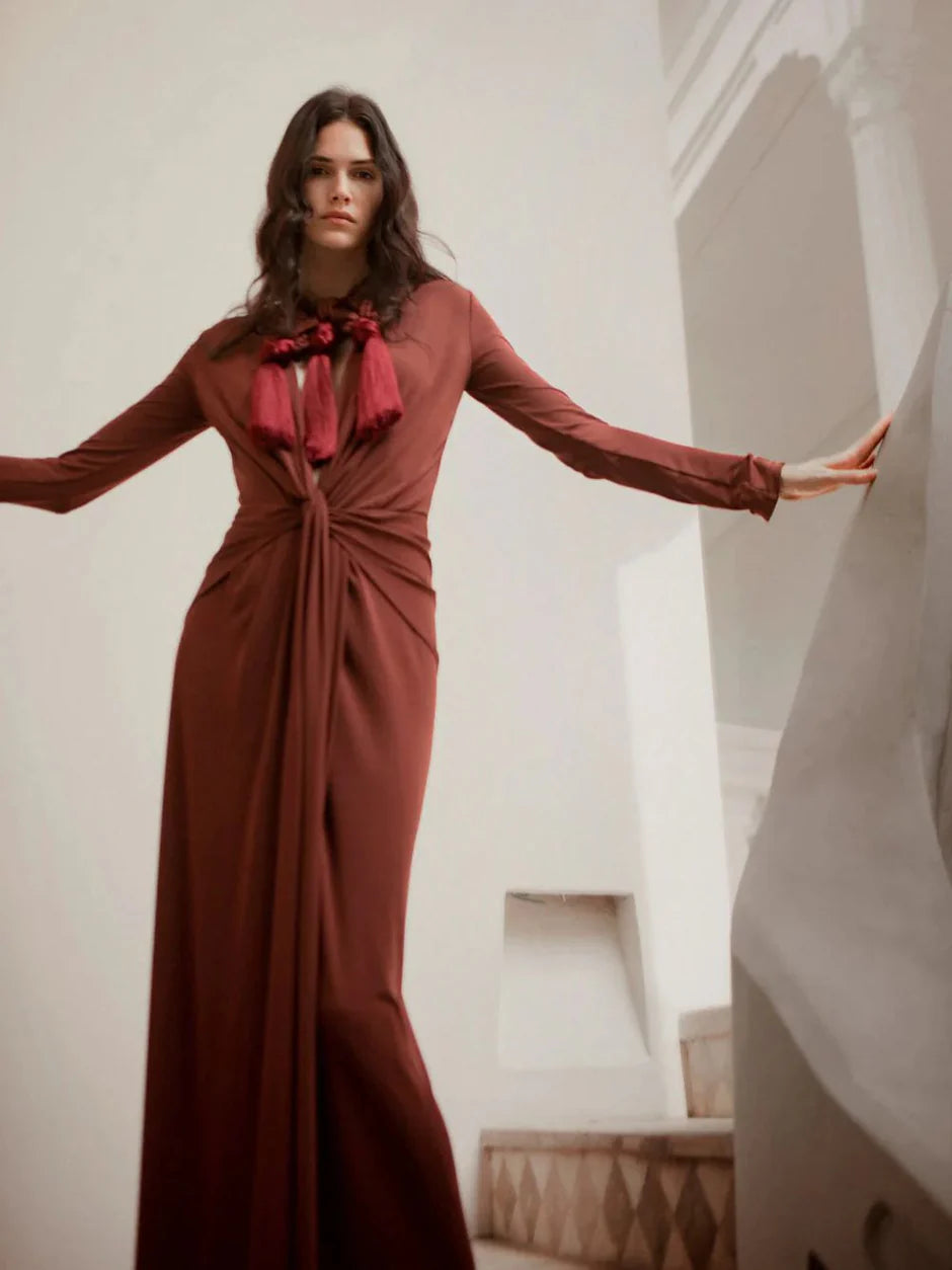 The Finding Yourself dress in rich chocolate brown features a flattering V-neck and long sleeves for versatile wear. Its detachable adjustable waist strap allows you to customize your silhouette for a tailored fit, making it a sophisticated choice for days when you want both comfort and style.