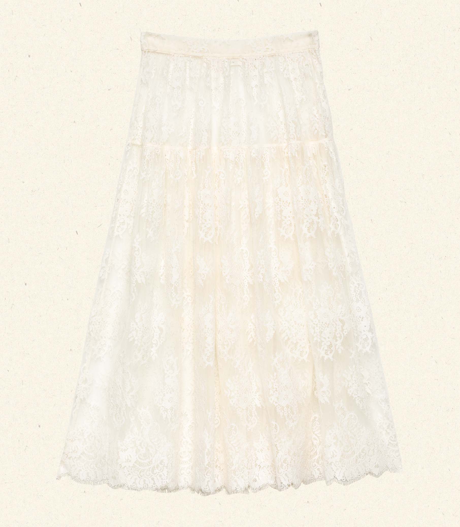Crafted from delicate chantilly-inspired lace, the Sebastiane Skirt by Doen embodies timeless romance with its flattering A-line silhouette. The high waist creates an elegant line while the scalloped hem adds refined detail as it gracefully reaches mid-shin. Unlined for a lightweight feel, this piece pairs beautifully with a slip for your preferred level of coverage. A sophisticated choice for occasions calling for understated femininity.