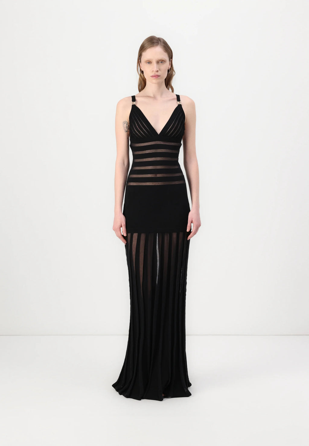 This Elisabetta Franchi maxi dress combines sophisticated knit fabric with elegant transparency details, creating a refined silhouette that balances coverage and allure. Expertly crafted, it offers a flattering fit ideal for formal occasions or evening events where style and comfort are paramount.
