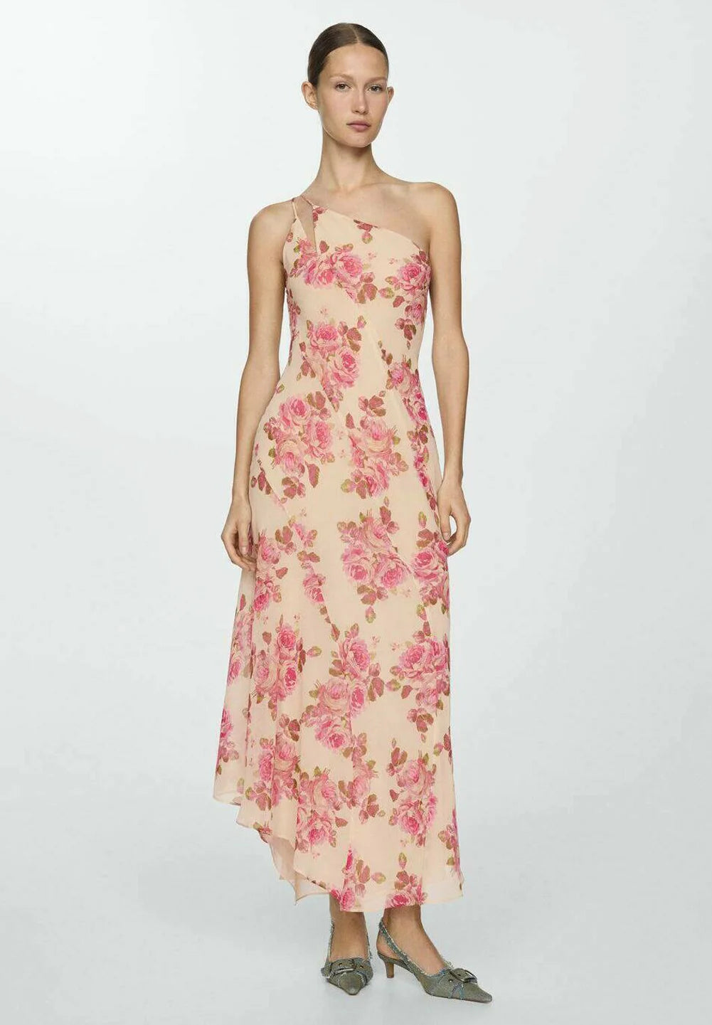 The Floral Slip Maxi Dress offers an elegant silhouette with its flowing maxi length and delicate floral pattern. Crafted for comfort and style, this dress features thin straps and a slip design that drapes gracefully over the body. Ideal for warm weather or layered in cooler seasons, it combines versatility with a timeless aesthetic perfect for both casual outings and special occasions.