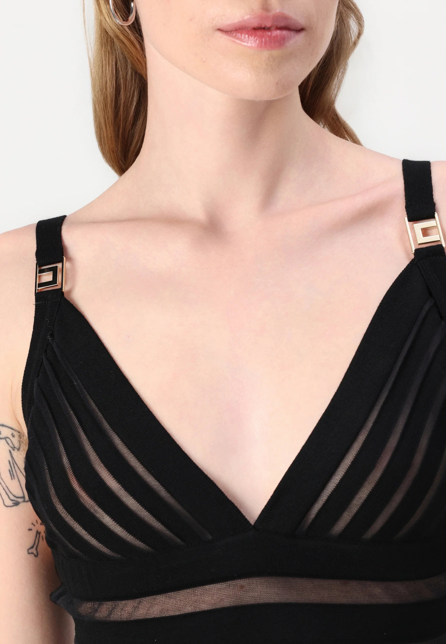 This Elisabetta Franchi maxi dress combines sophisticated knit fabric with elegant transparency details, creating a refined silhouette that balances coverage and allure. Expertly crafted, it offers a flattering fit ideal for formal occasions or evening events where style and comfort are paramount.