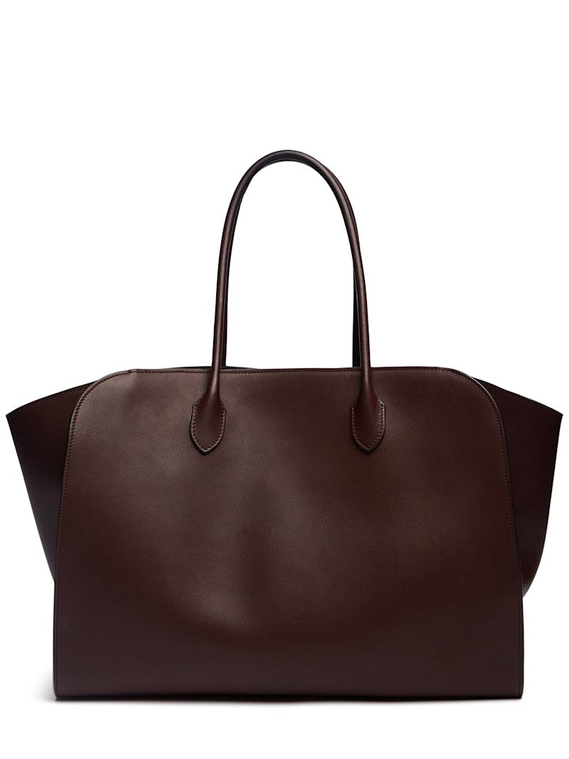 Crafted in Italy from 100% calf leather, the Marlo 17 Saddle Leather Tote Bag combines refined craftsmanship with practical design. Its chestnut hue complements double top handles for comfortable carrying, while a top toggle closure ensures secure access. The tote is lined and features an internal pocket to organize essentials, making it a sophisticated yet functional everyday accessory.