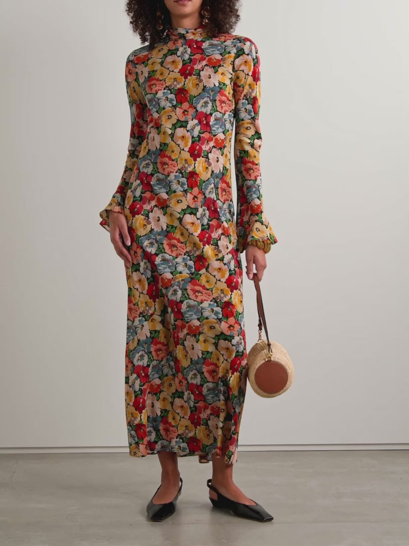 Crafted from washed silk crepe de chine, this dress offers an elegant silhouette through expert tailoring. It features a refined mock neck and dramatic flared sleeves with delicate ruffle-trimmed cuffs. The fitted bodice, paired with an invisible side zipper, transitions smoothly into an ankle-length bias-cut skirt, providing graceful movement. Perfect for those who appreciate timeless style enriched with subtle, sophisticated details.