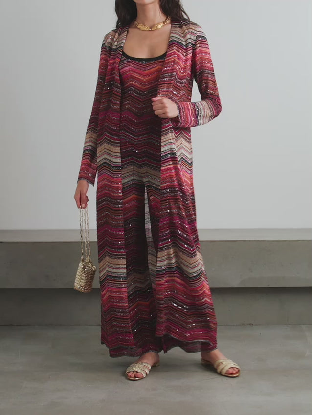 Missoni Mare's legendary zigzag pattern debuted in the brand's Fall '67 collection and remains a timeless signature. This longline cardigan is meticulously crochet-knitted with shimmering metallic threads and sequins that catch the light with every movement. The flowing silhouette drapes elegantly, making it perfect for layering over evening wear or wearing as a statement piece on its own. A heritage design that celebrates decades of Italian craftsmanship.