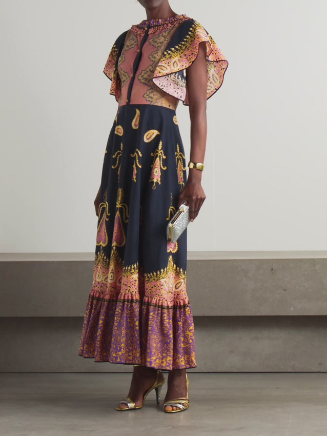 Inspired by Valentino Garavani's archives and Alessandro Michele's Resort '25 debut, this midi dress channels '70s bohemian elegance. Crafted from soft cotton-muslin, it features an intricate paisley print that captures the era's ornate aesthetic. Delicate ruffles frame the neckline, sleeves, and hem, adding romantic movement and texture. A timeless piece that bridges vintage inspiration with contemporary sophistication.