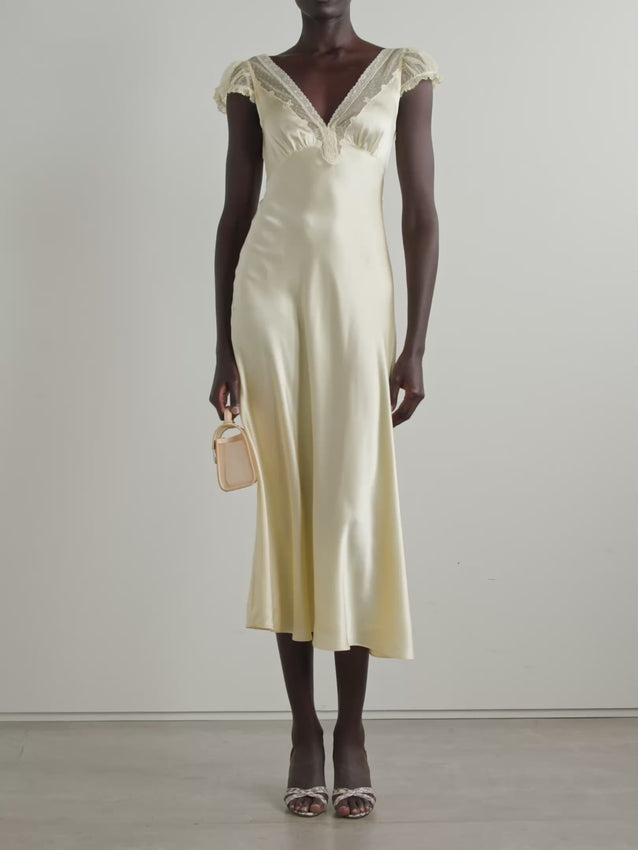 Elegant Corelia midi dress crafted from luxurious silk-satin with delicate tulle trim detailing. The flowing silhouette flatters the figure while the refined fabric blend offers a sophisticated drape. Perfect for special occasions, evening events, or elevated everyday wear. The tulle accents add a romantic, ethereal touch that catches light beautifully. A timeless piece that transitions seamlessly from day to night.