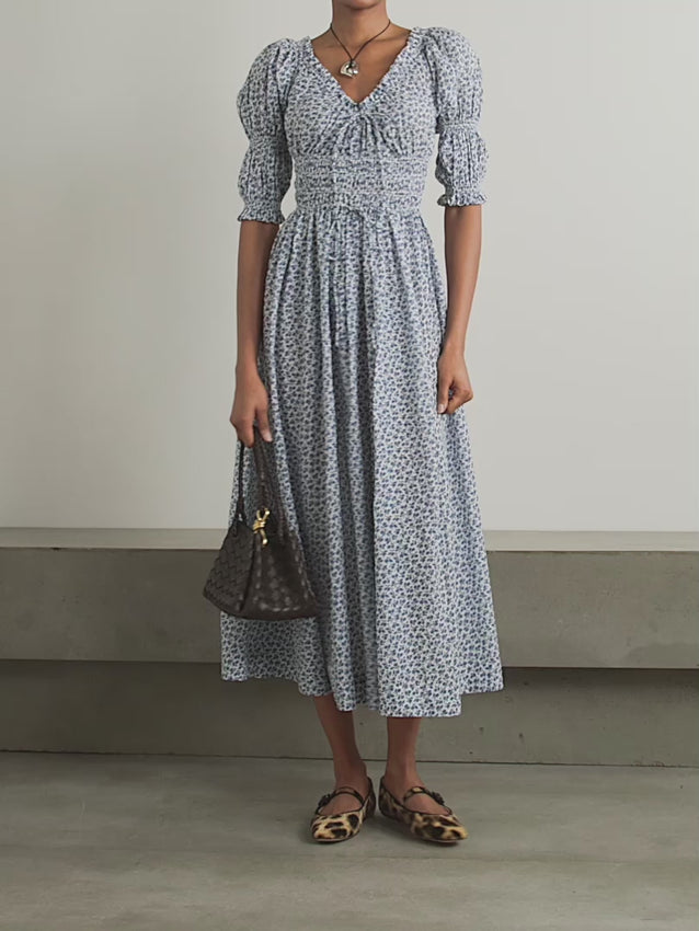 Effortless elegance meets sustainable style with the Ischia midi dress. Crafted from organic cotton-voile, this piece features delicate shirring that creates a flattering silhouette while the vibrant floral print adds timeless charm. Perfect for warm days, the breathable fabric drapes beautifully and moves with you. A versatile wardrobe essential that transitions seamlessly from day to evening.