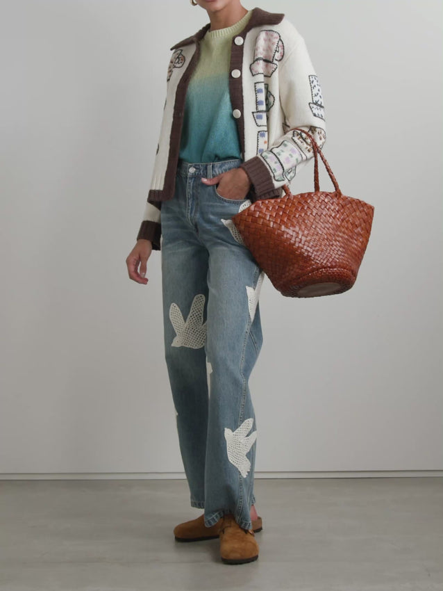 Elevate your everyday style with the Emila embroidered wool-blend cardigan. Crafted from a luxurious wool blend, this piece offers warmth and sophistication in equal measure. Delicate embroidery details add a touch of artisanal charm, making it perfect for layering over dresses, tees, or sweaters. The timeless design transitions seamlessly from season to season, while the quality construction ensures lasting wear. Ideal for those who appreciate refined, understated elegance.