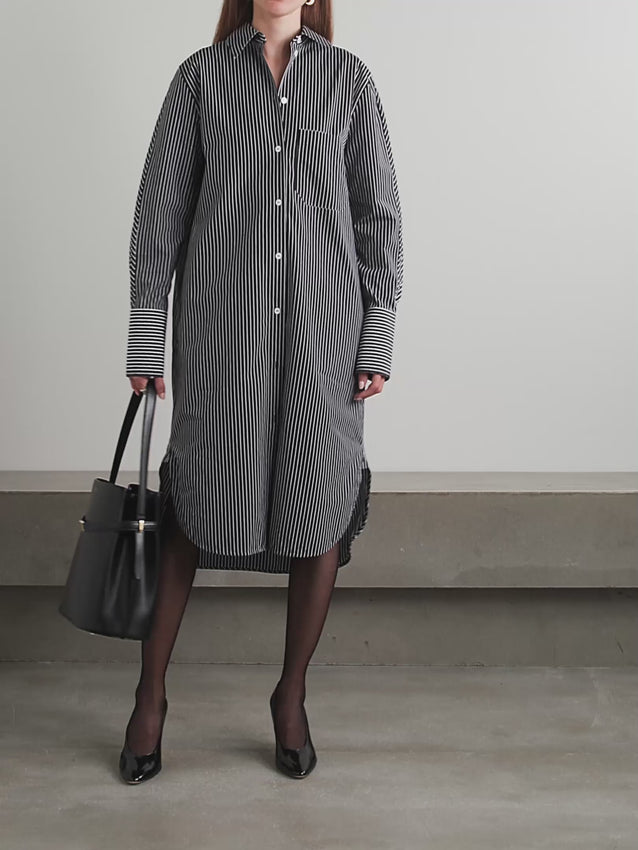 Designed with versatility in mind, this midi shirt dress transitions effortlessly from boardroom to brunch. Crafted from crisp organic cotton-poplin, it features a relaxed boxy silhouette that flatters while allowing freedom of movement. Raw-edge detailing on the collar and cuffs adds understated sophistication. The timeless striped pattern ensures this piece works across seasons and occasions, making it an essential addition to any refined wardrobe.