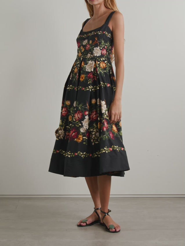 Embrace effortless elegance with the Alcaparra Paramo midi dress, a romantic piece from Agua by Agua Bendita. Crafted from lightweight cotton-poplin, this dress features a delicate floral print complemented by embroidered details along the neckline. Structured wide pleats at the waist create a flattering silhouette that moves beautifully with you. Perfect for warm days and special occasions, pair with sandals and dainty jewelry for an understated, sophisticated look.