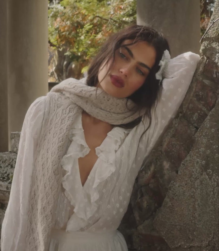 The Hardy Top returns in soft organic cotton voile, reimagined with allover embroidery. Airy and romantic, the Hardy features a plunging V-neckline framed with cascading ruffles, with delicate clustered pintucks at the yoke and back. Generous full-length sleeves finish in lace-trimmed ruffle cuffs. Wear it loose, or tuck it into your favorite high-waisted jeans.