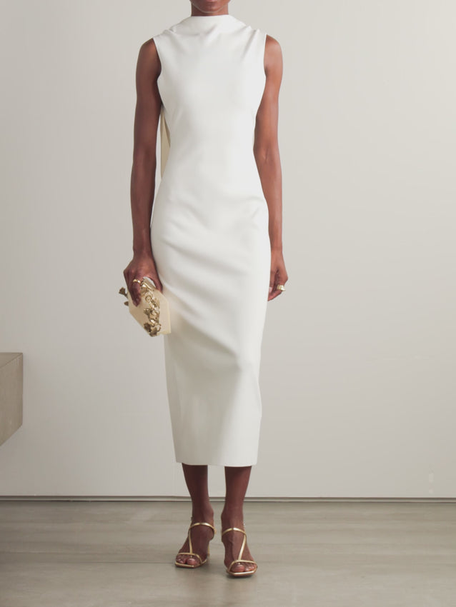 Elevate your evening with the Deirdra midi dress by CULT GAIA. This sophisticated knitted piece features an open-back design with graceful draping that creates movement and allure. Delicate embellishments add a touch of glamour, while the midi length offers timeless elegance. Perfect for special occasions or upscale gatherings, this dress combines contemporary design with refined craftsmanship for a statement look.