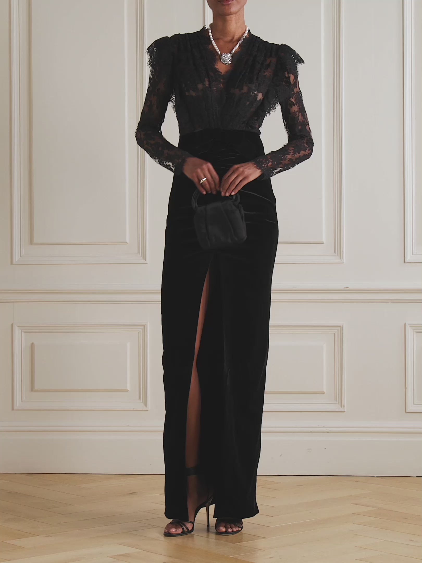 Elevate your evening wardrobe with this exquisite gown from Alessandra Rich. Crafted from sumptuous velvet and delicate lace, this piece seamlessly blends texture and refinement. The signature bow detail adds a touch of feminine elegance, creating a striking focal point that captures attention. Perfect for galas, formal celebrations, or any occasion demanding understated luxury, this gown drapes beautifully to flatter the silhouette while maintaining an air of timeless sophistication.