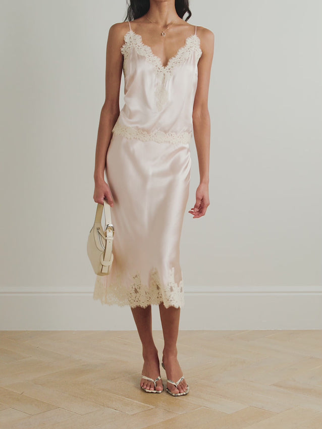 Embrace unapologetic femininity with the Kira camisole by Doen, crafted from sumptuous silk-satin and adorned with delicate corded lace trim. This romantic piece channels lingerie-inspired elegance, perfect for layering or wearing as a statement on its own. Adjustable straps ensure a personalized fit that moves with you. A timeless essential that celebrates refined, effortless style.