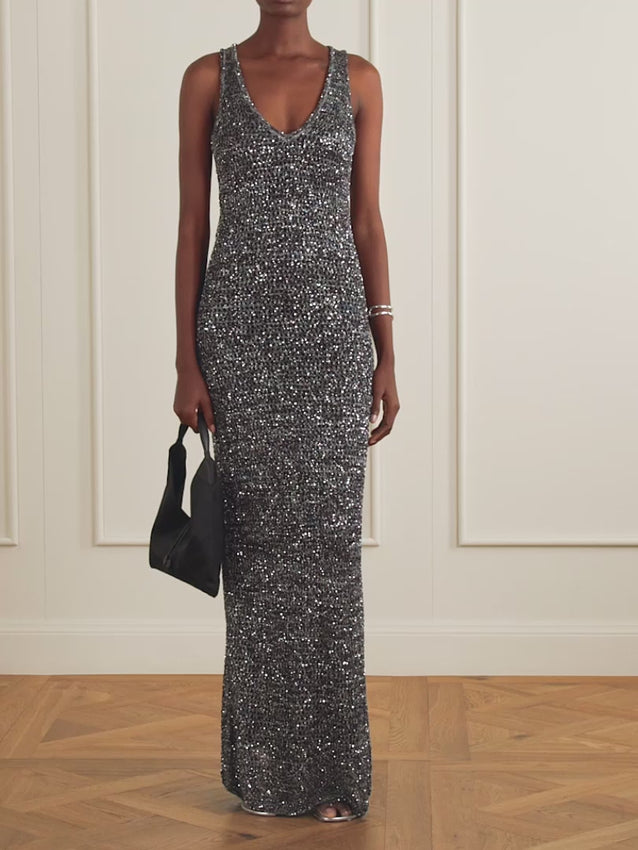 Missoni transforms open-knit mesh into an art form with this embellished maxi dress. The sheer, fluid silhouette showcases intricate knit work that plays with light and shadow, creating depth and movement across the garment. A refined choice for those seeking texture and elegance in a single piece.