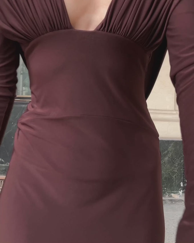 Embrace effortless elegance with the Lucia Open-back Dress in Cacao by Arcina Ori. This stunning piece features a daring plunging neckline and graceful open back that beautifully accentuate your silhouette. The flowing hem moves with you, creating a captivating effect with every stride. Perfect for making a sophisticated statement at any occasion.