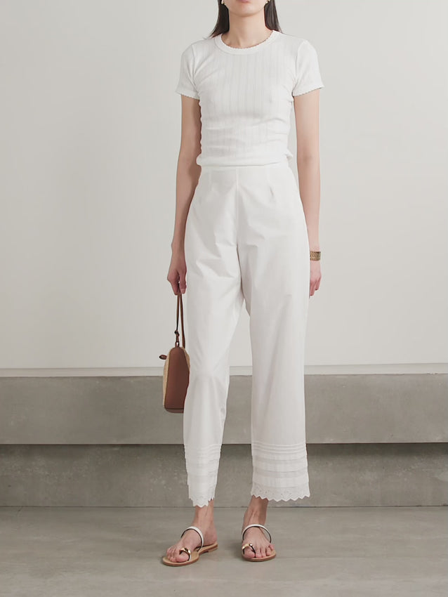 Elevate your wardrobe with the Francisca Pants, a timeless piece that combines feminine details with effortless style. Crafted from lightweight cotton-poplin, these high-waisted pants feature delicate broderie anglaise trims and precise pintucks that run along the cropped straight legs, adding visual interest and sophistication. The airy fabric makes them perfect for warm weather, while the high-rise silhouette flatters and elongates the frame. 