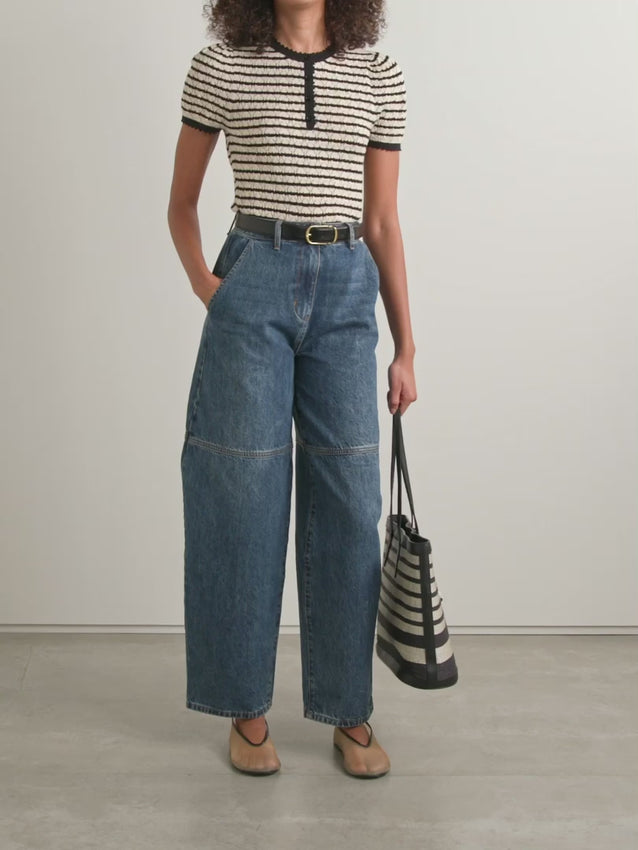 The Brandie striped pointelle-knit top by DÔEN blends cotton and silk for a soft, breathable feel. Its delicate pointelle-knit detailing and contrasting stripes add subtle texture and visual interest. Designed with a slightly loose fit, it features scalloped trims on the crew neckline, short sleeves, and hem for a refined finish. 