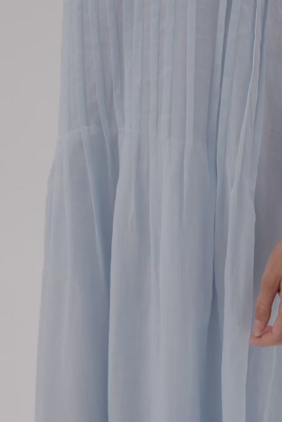 The perfect cornflower blue awaits in this thoughtfully designed maxi dress. Crafted entirely from breathable ramie, it features a flattering deep V neckline and delicate tuck detailing that skims the silhouette. A dress destined to become your go-to choice for any occasion.