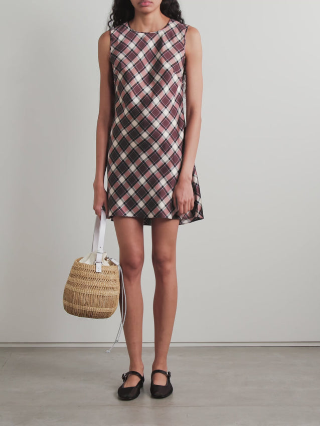 Celebrate your femininity in the Alamere checked silk-satin mini dress. Crafted from luxurious silk-satin, this piece features a timeless check pattern and expertly placed darts at the chest that enhance its slightly loose, flattering silhouette. Perfect for effortless elegance, pair with delicate flats for a refined daytime look or knee boots for evening sophistication. A wardrobe essential that embodies the brand's philosophy of honoring womanhood and natural beauty.