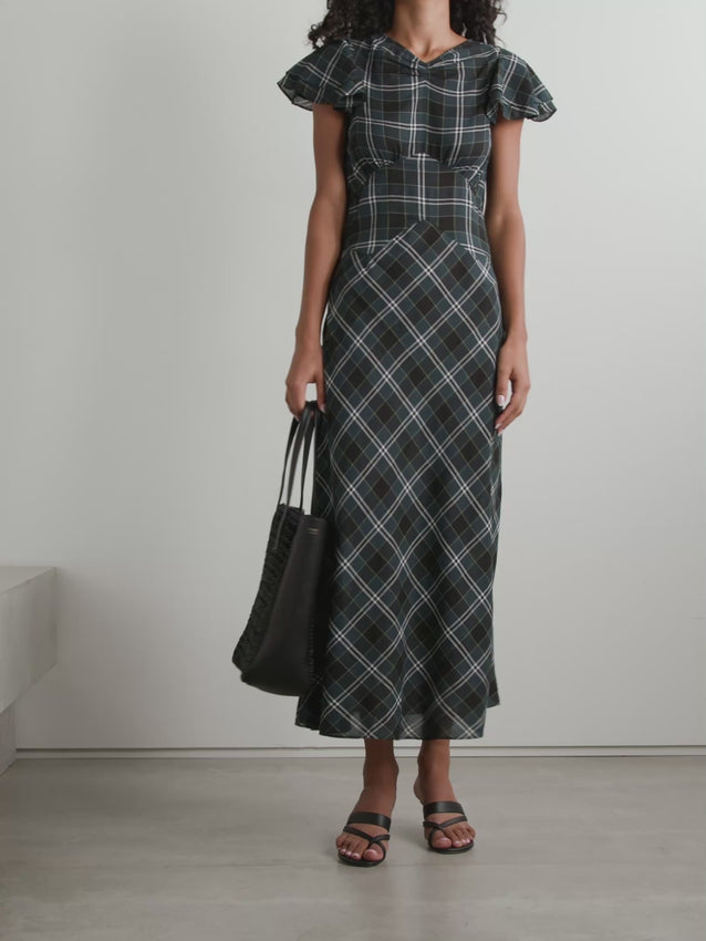 The Seraphine midi dress combines timeless elegance with thoughtful design. Crafted from checked cotton-twill, strategically placed panels accentuate your silhouette while the high gathered neckline and fluttering sleeves create a romantic, flattering look. Perfect for elevated everyday wear or special occasions, this piece transitions effortlessly from season to season.