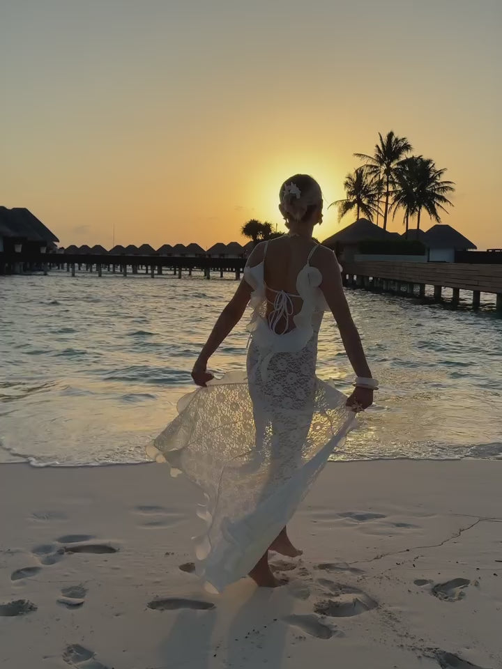 The Catherine Gown is an elegant maxi dress designed to highlight femininity with refined sophistication. Its plunging back neckline adds a subtle allure, complemented by delicate organza ruffles and adjustable straps that ensure both comfort and a tailored fit. Crafted individually, this gown celebrates your unique style while offering an exclusive, striking presence for any special occasion.