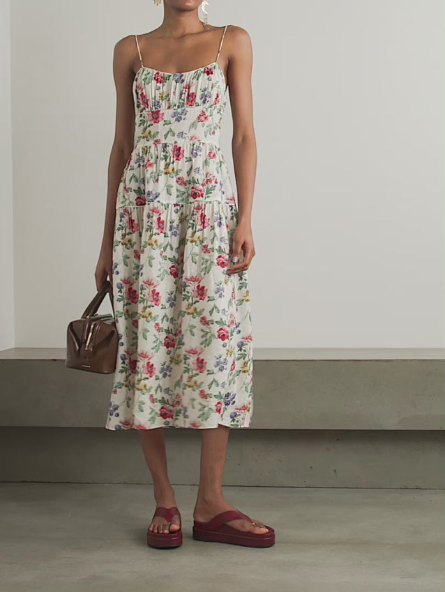 Discover timeless elegance with the Benoit midi dress, a masterpiece from DÔEN's coveted collection. Crafted from luxurious ramie fabric, this romantic piece features delicate tiered layers adorned with an enchanting floral print inspired by classic Liberty patterns. The gathered bust creates a flattering silhouette, while whisper-thin straps and an ethereal skirt deliver effortless sophistication.