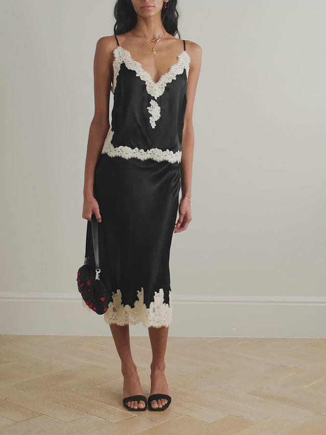 Embrace unapologetic femininity with the Kira camisole by Doen, crafted from sumptuous silk-satin and adorned with delicate corded lace trim. This romantic piece channels lingerie-inspired elegance, perfect for layering or wearing as a statement on its own. Adjustable straps ensure a personalized fit that moves with you. A timeless essential that celebrates refined, effortless style.
