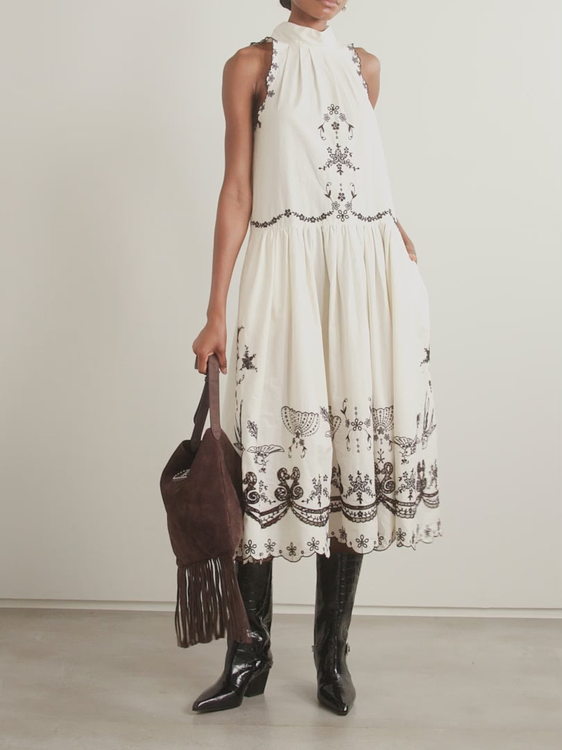 The Kingsley embroidered cotton midi dress by SEA NY showcases delicate pleats that elegantly fan out to reveal intricate embroidered birds, flowers, and garlands. Crafted from breathable cotton, it features broderie anglaise cutouts along the hem, adding refined detail and enhancing its airy, sophisticated appeal—ideal for warm-weather occasions requiring both comfort and expert design.