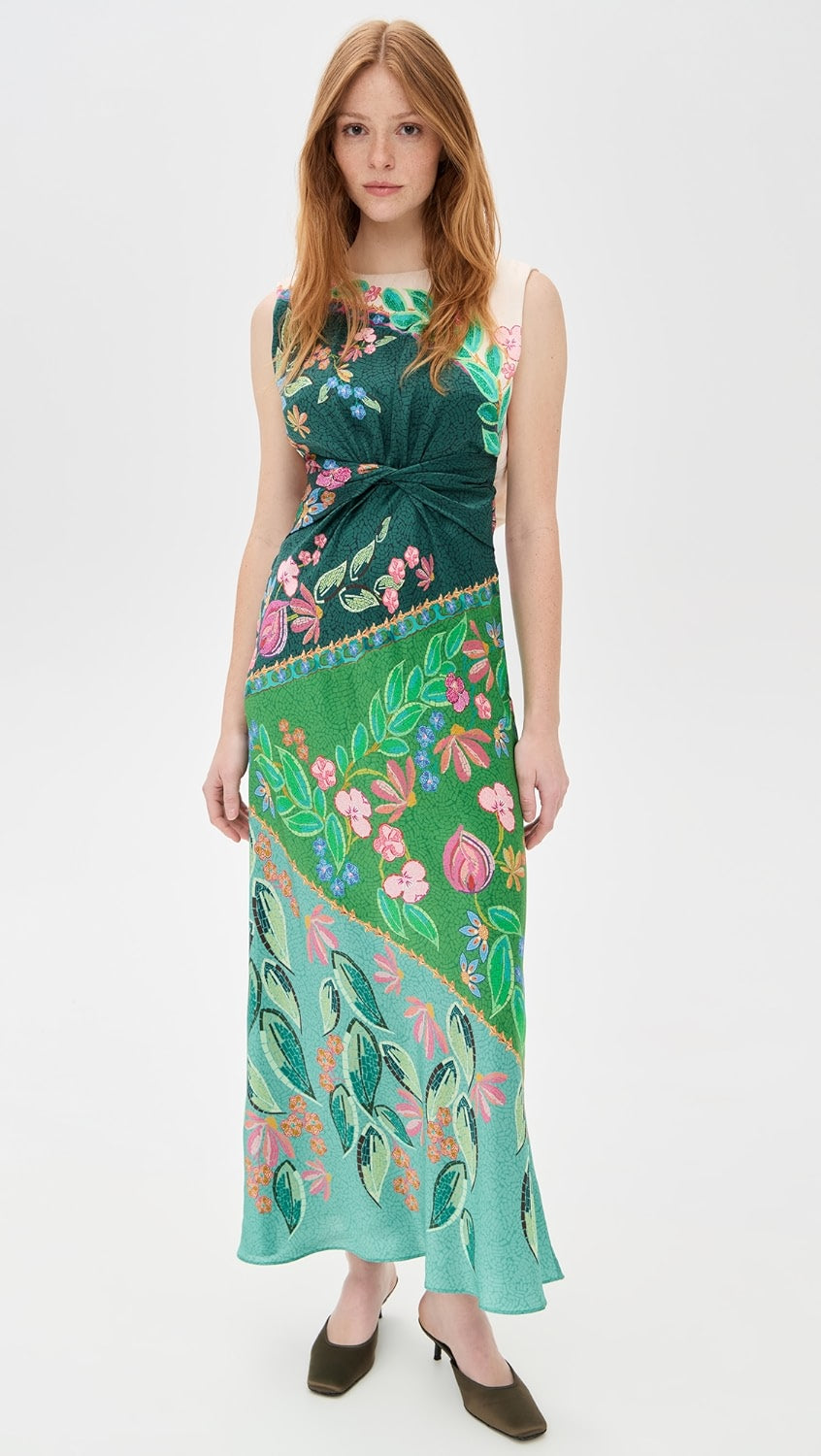 Crafted from lightweight silk charmeuse, the Gwen Dress by Saloni features a delicate floral print that enhances its elegant maxi silhouette. Expertly designed with a twist detail at the waist, it flatters the figure while a subtle split at the back, secured by hook-and-eye closures, offers ease of movement. The dress is completed with a refined crew neck and a hidden back zip for a smooth, tailored finish, making it an exquisite choice for sophisticated occasions.