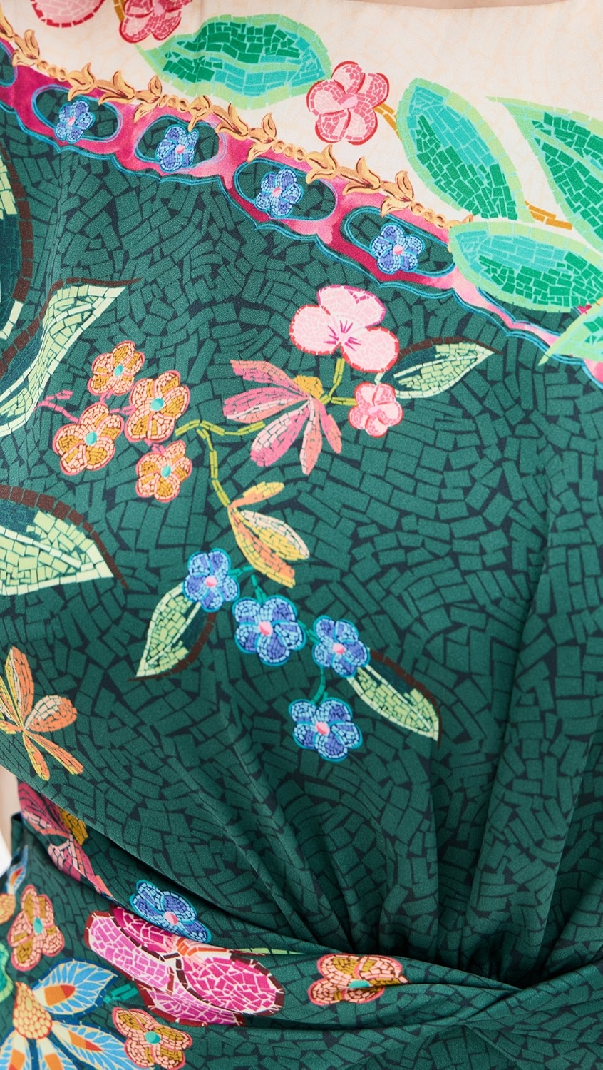 Crafted from lightweight silk charmeuse, the Gwen Dress by Saloni features a delicate floral print that enhances its elegant maxi silhouette. Expertly designed with a twist detail at the waist, it flatters the figure while a subtle split at the back, secured by hook-and-eye closures, offers ease of movement. The dress is completed with a refined crew neck and a hidden back zip for a smooth, tailored finish, making it an exquisite choice for sophisticated occasions.