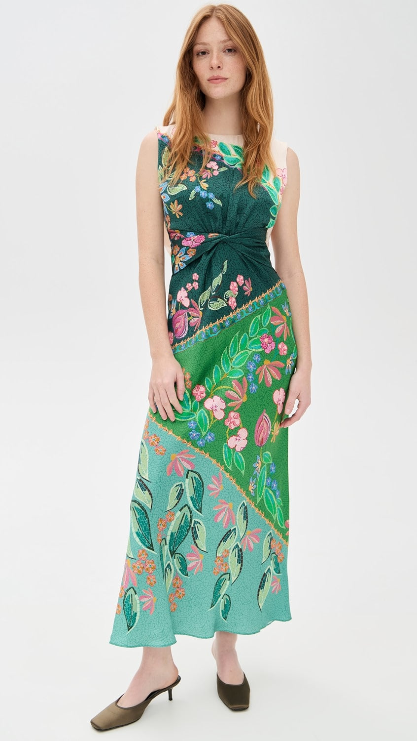 Crafted from lightweight silk charmeuse, the Gwen Dress by Saloni features a delicate floral print that enhances its elegant maxi silhouette. Expertly designed with a twist detail at the waist, it flatters the figure while a subtle split at the back, secured by hook-and-eye closures, offers ease of movement. The dress is completed with a refined crew neck and a hidden back zip for a smooth, tailored finish, making it an exquisite choice for sophisticated occasions.