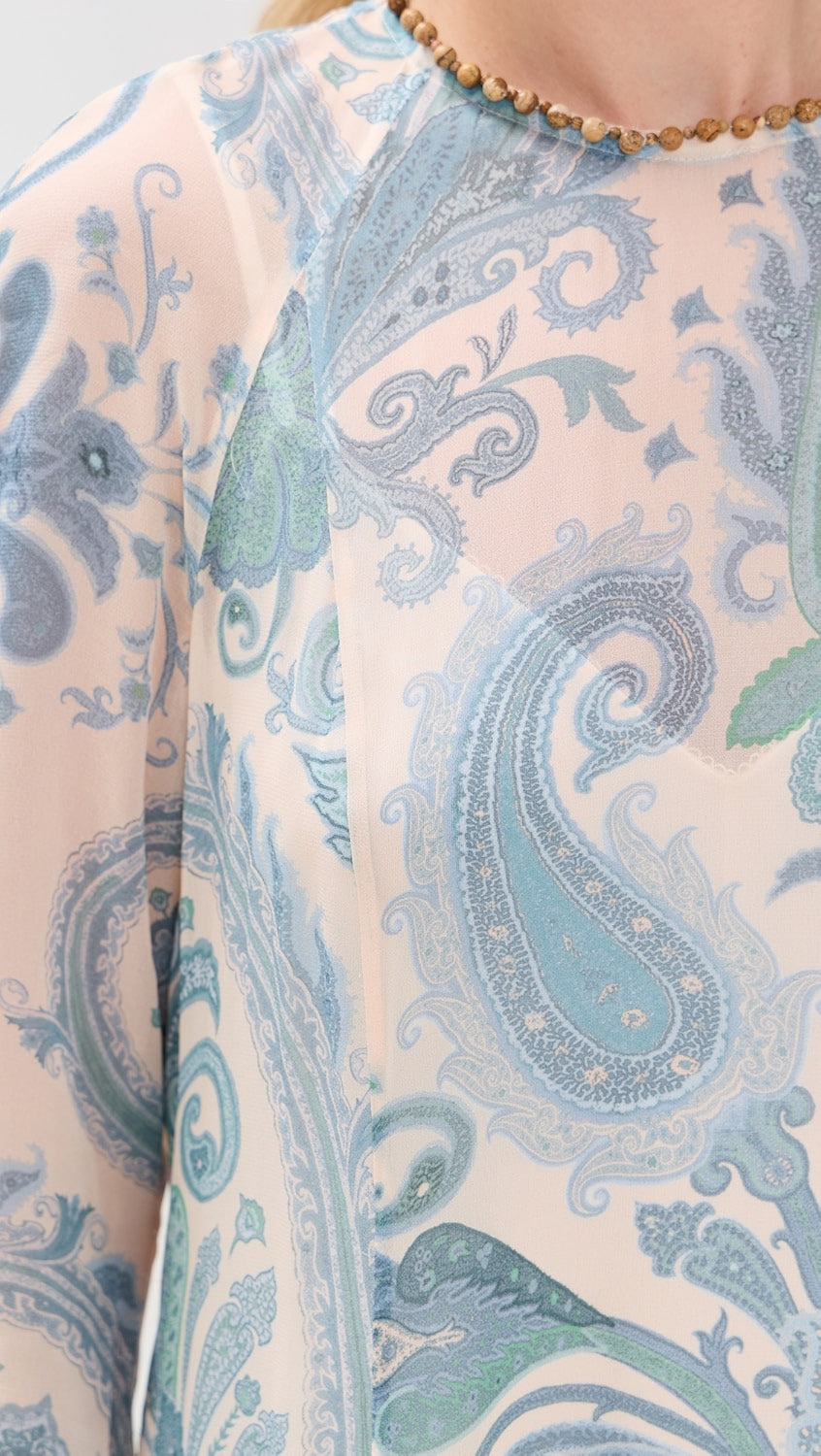 Crafted from lightweight, non-stretch chiffon, the Illuminate Sheath Dress by Zimmermann features an elegant paisley print that enhances its refined silhouette. The beaded neckline and cuffs add a touch of sophisticated detail, while the maxi length and crew neck provide classic coverage. A discreet back zipper ensures a tailored fit, making this dress a perfect choice for formal occasions where polished style is essential.